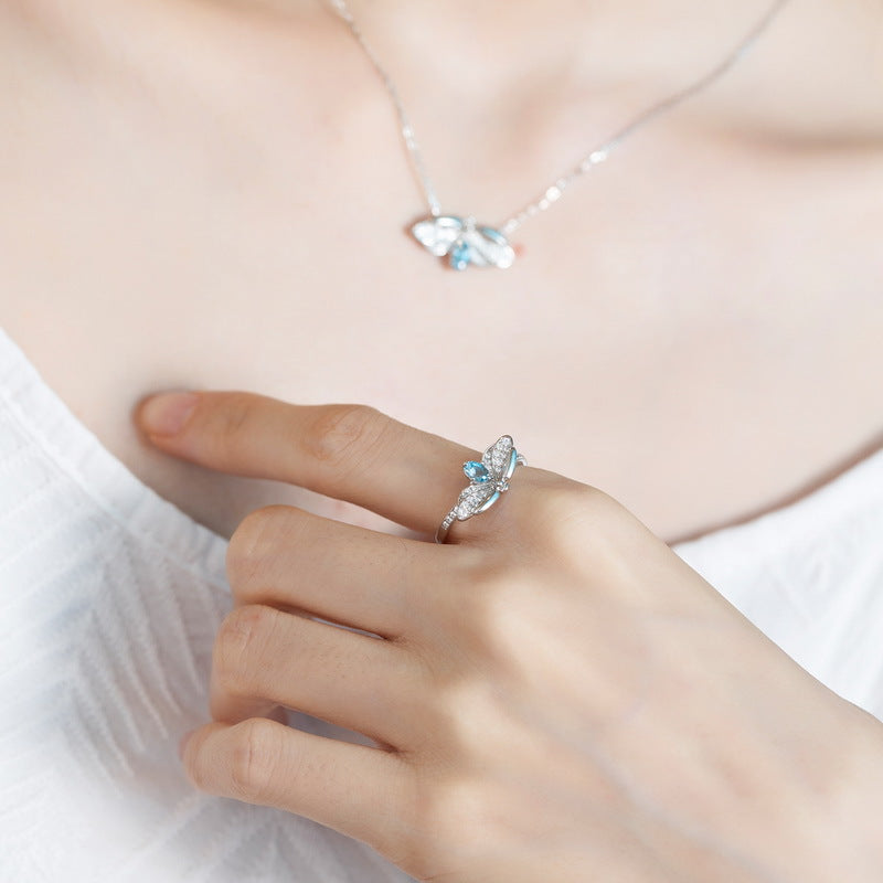 Oval Blue Topaz Zircon Glowworm Opening Sterling Silver Ring