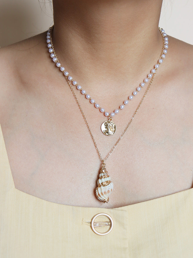 Elegant Pearl and Gold Coin Shell Necklace - Stylish and Chic Sweater Chain.