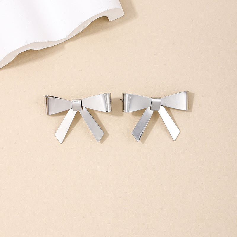 Exaggerated Bow Embellished Metallic Earrings with a Touch of European Flair