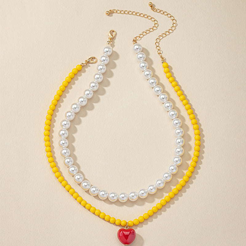 Lighthearted Pearl and Acrylic Love Necklace - Vienna Verve Collection