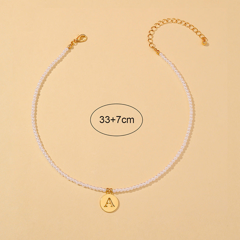 Elegant Hollow English Letter Pendant Necklace with Pearl Accents