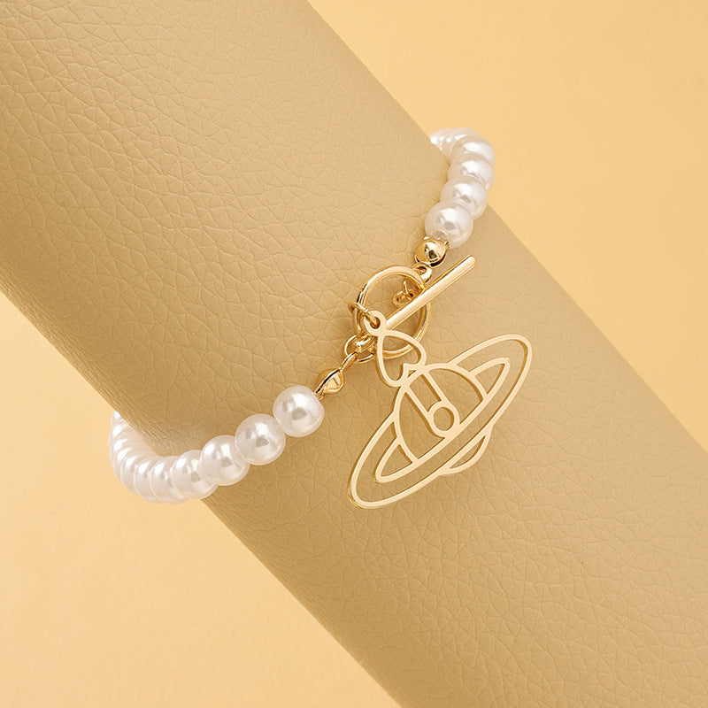 Pearl Beaded Hip-Hop Bracelet with Planet Pendant and Metal Accents