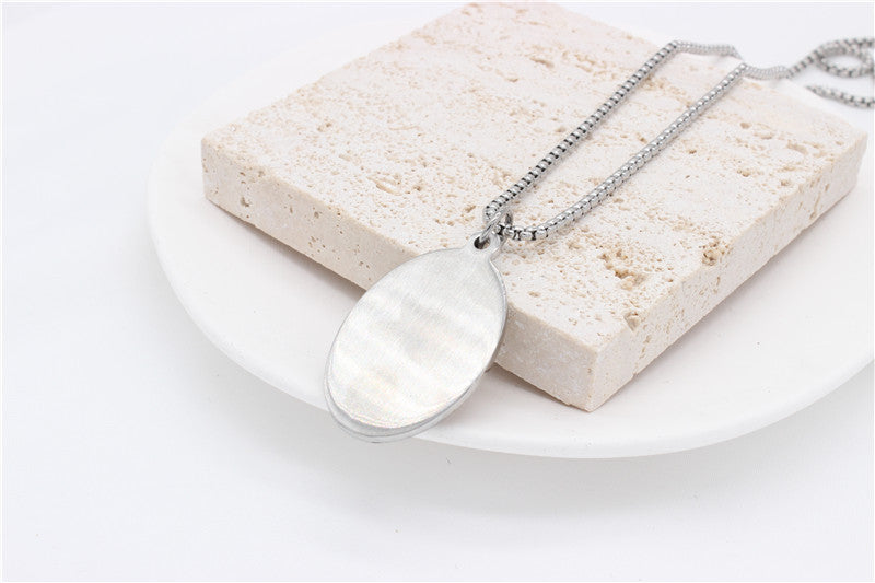 Madonna Oval Tag Pendant Titanium Steel Unisex Necklace Planderful Everyday Genie Collection Protection Symbol