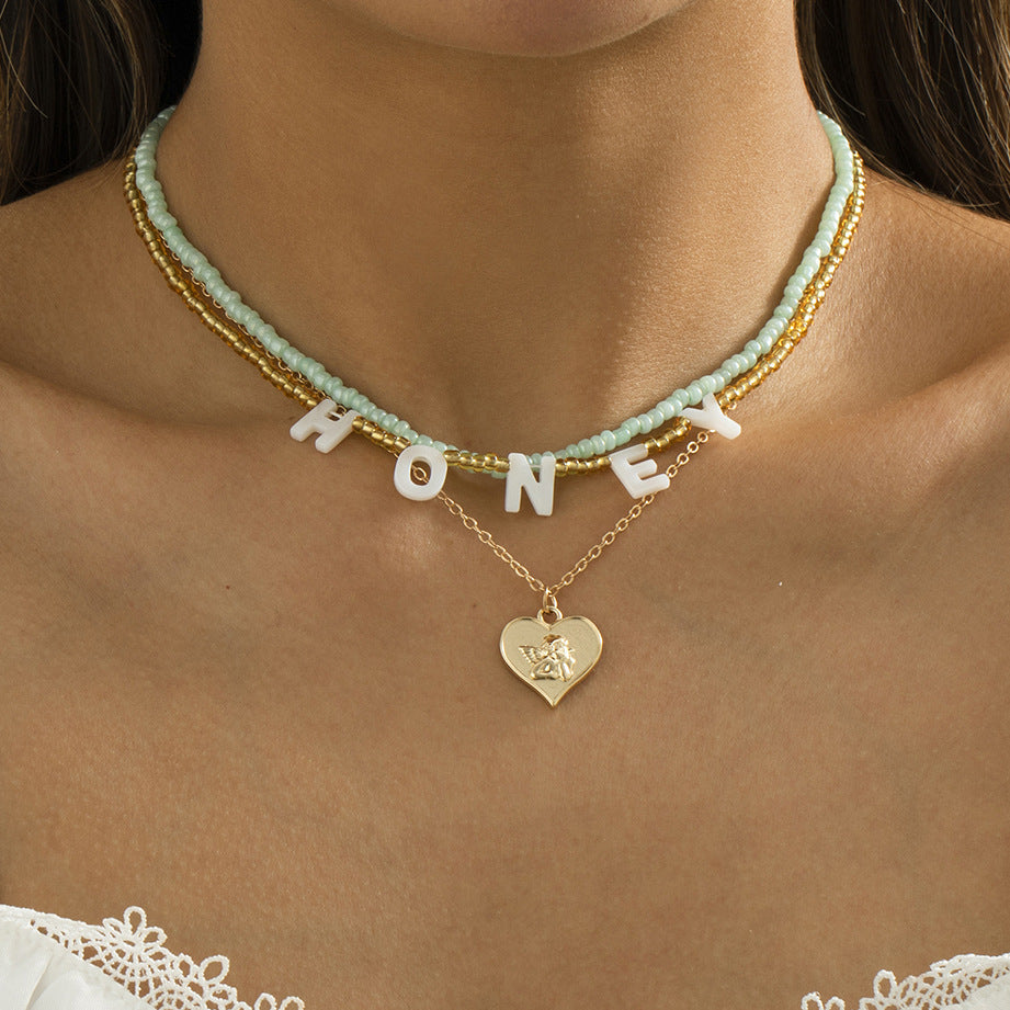 Honey Letter Necklace Stacked Portrait Beaded Heart By Planderful Vienna Verve For Women Chic Statement Jewelry