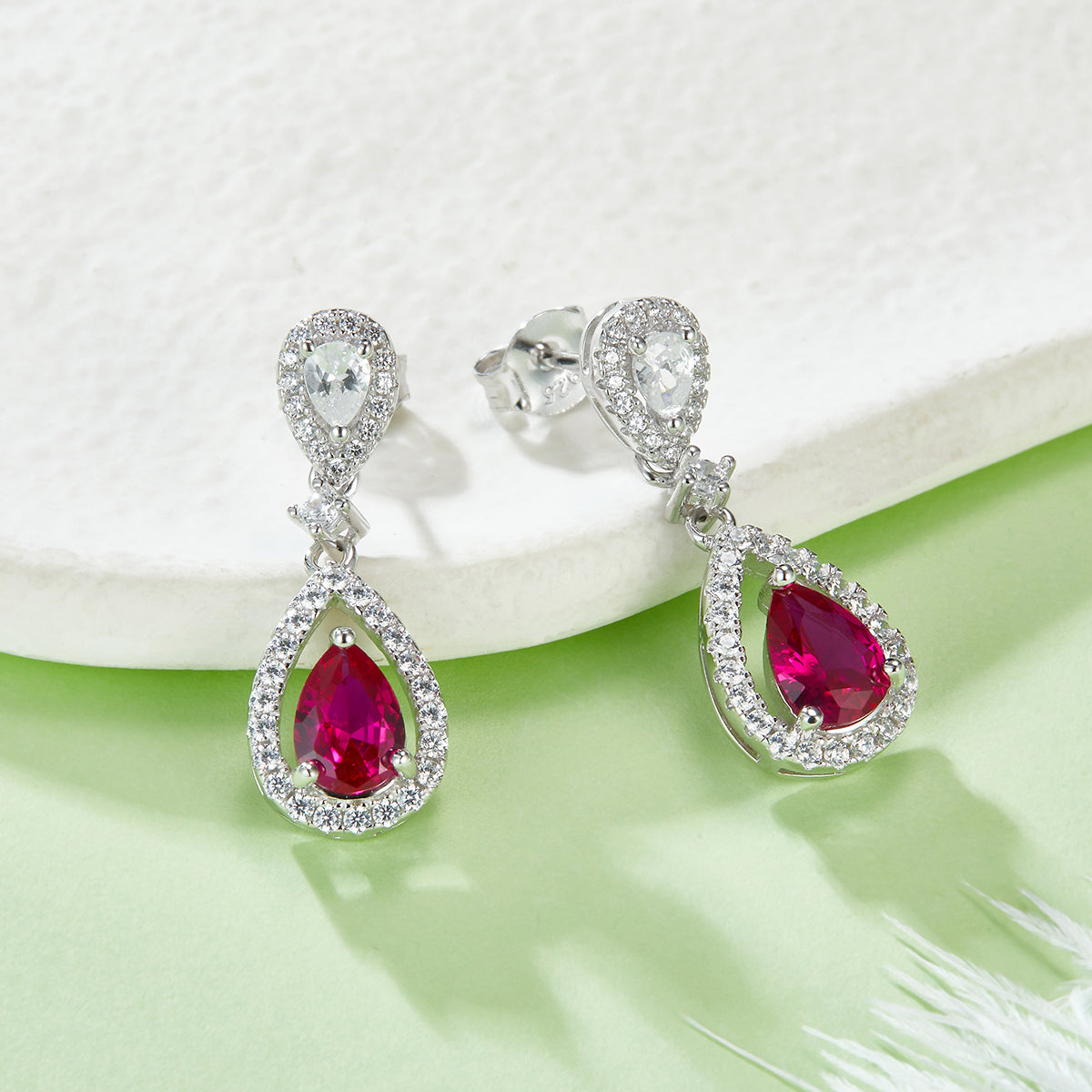 0.8 Carat Pear Shaped Lab Created Ruby Halo Drop Earrings in S925 Silver Plated Platinum