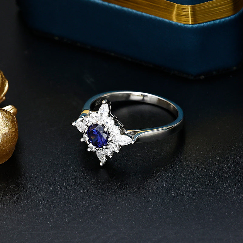 Round Cut Blue Zircon Flower Halo Silver Ring