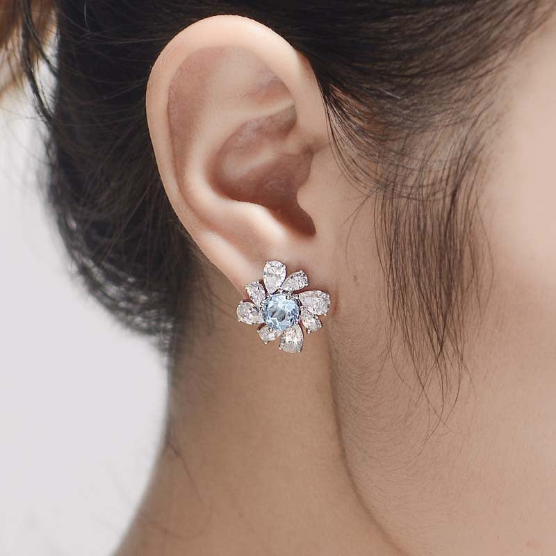 (1.0CT) Sky Blue Natural Topaz 6.5mm Round Cut Annular Petals Silver Studs Earrings for Women
