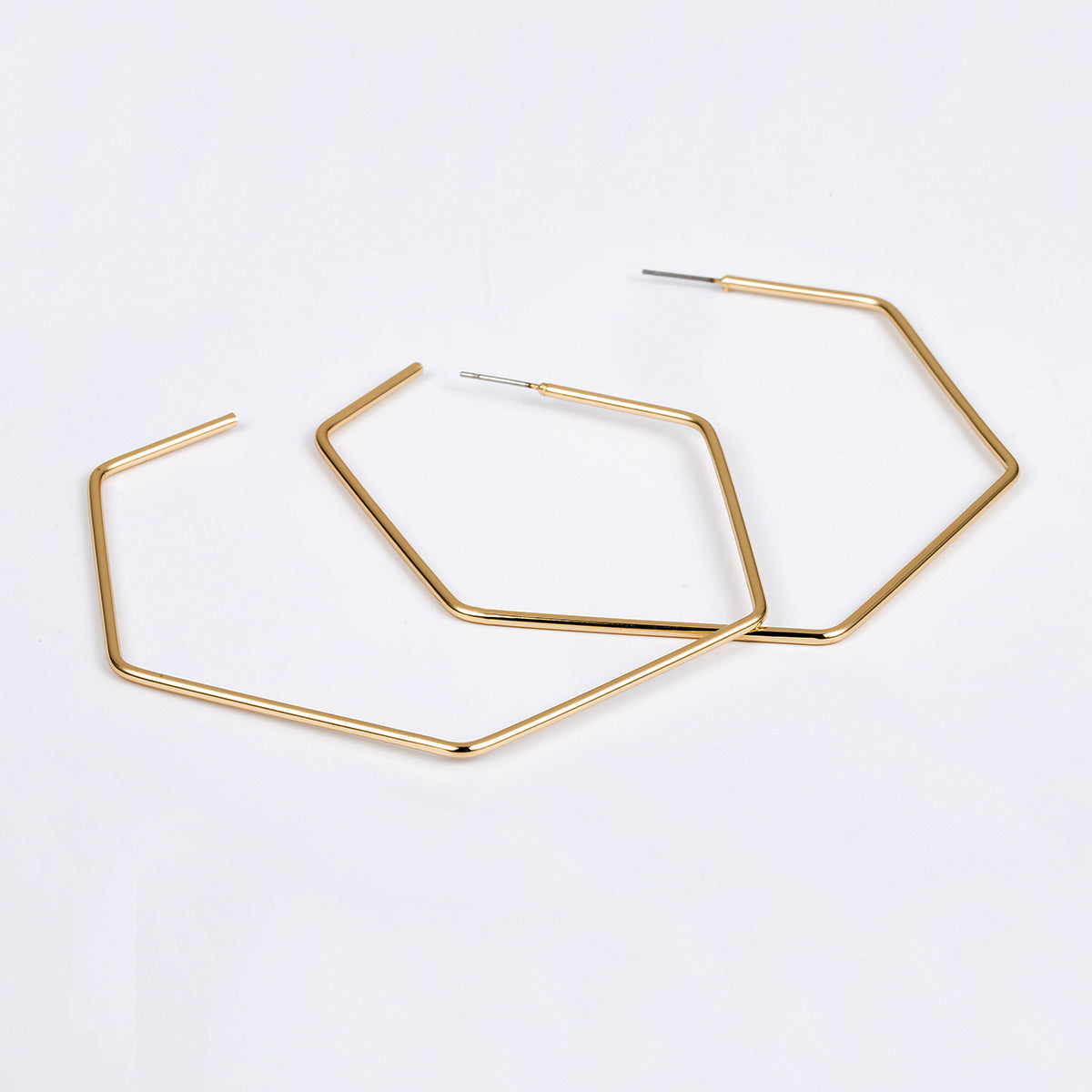 Exaggerated Silhouette Metal Earrings with Hexagonal Openings