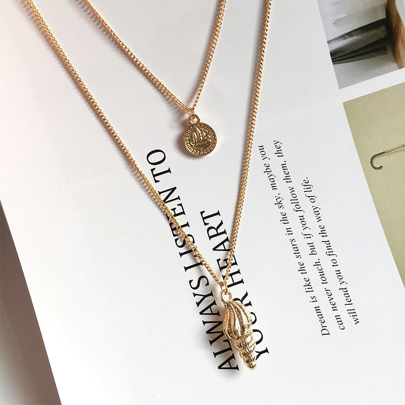 Gold Coin Conch Necklace with Minimalist Design and European Influence