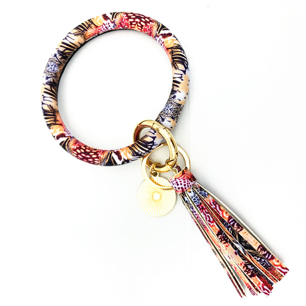 Celebrity Charm Leather Tassel Keychain Bracelet Embellished with Pendant - Vienna Verve Collection