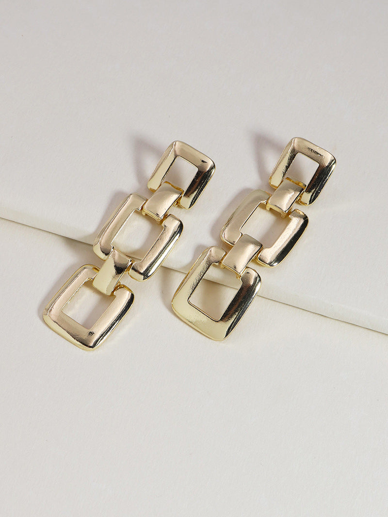 "Metallic Geometry Statement Earrings with Chain Detail"