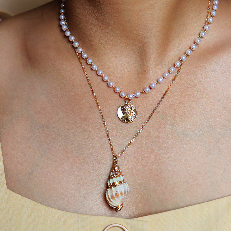 Elegant Pearl and Gold Coin Shell Necklace - Stylish and Chic Sweater Chain.