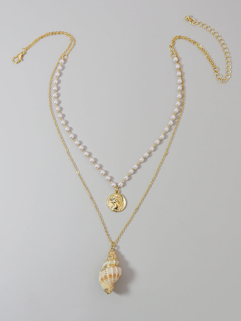 Elegant Pearl and Gold Coin Shell Necklace - Stylish and Chic Sweater Chain.