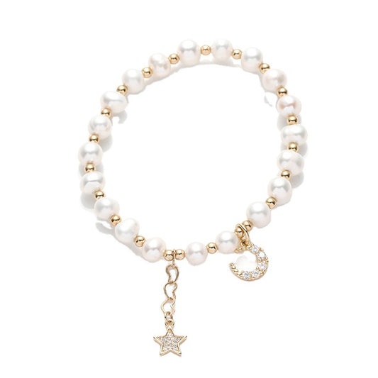 Fortune's Favor Sterling Silver Freshwater Pearl Bracelet with Delicate Stars and Moon Design