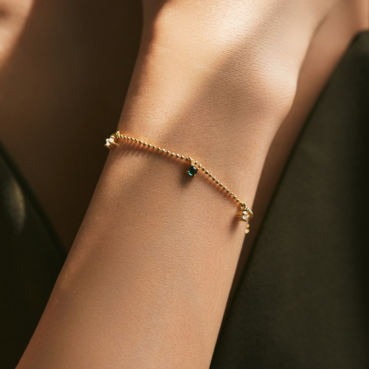 Elegant Sterling Silver Bracelet with Emerald Zircon Accent