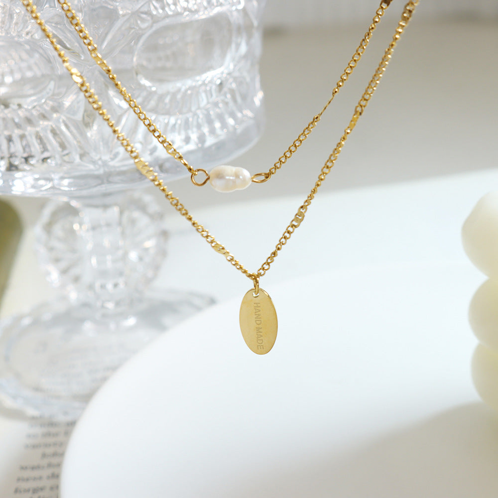 Elegant Multi-Layer Pearl Necklace with Gold Lock Bone Chain
