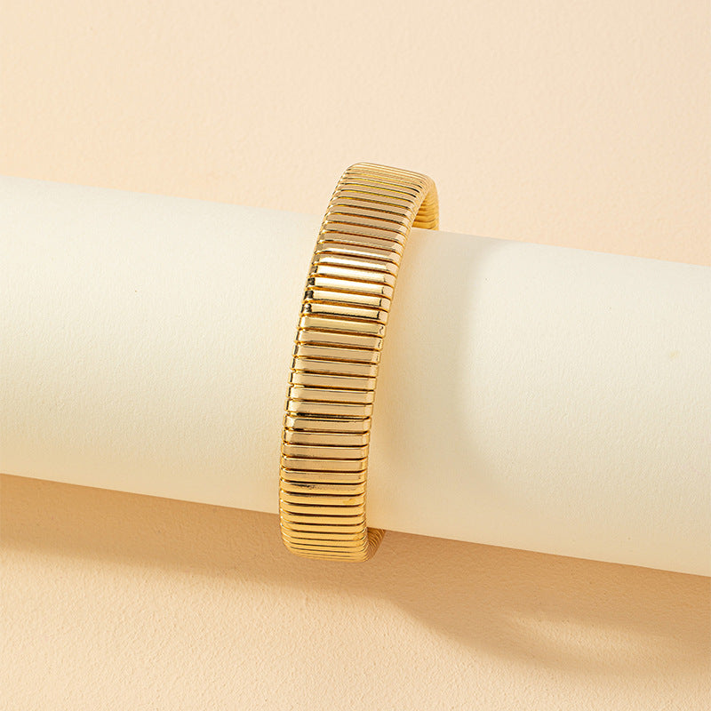 Golden Striped Bracelet with Vintage Appeal and Retro Charm