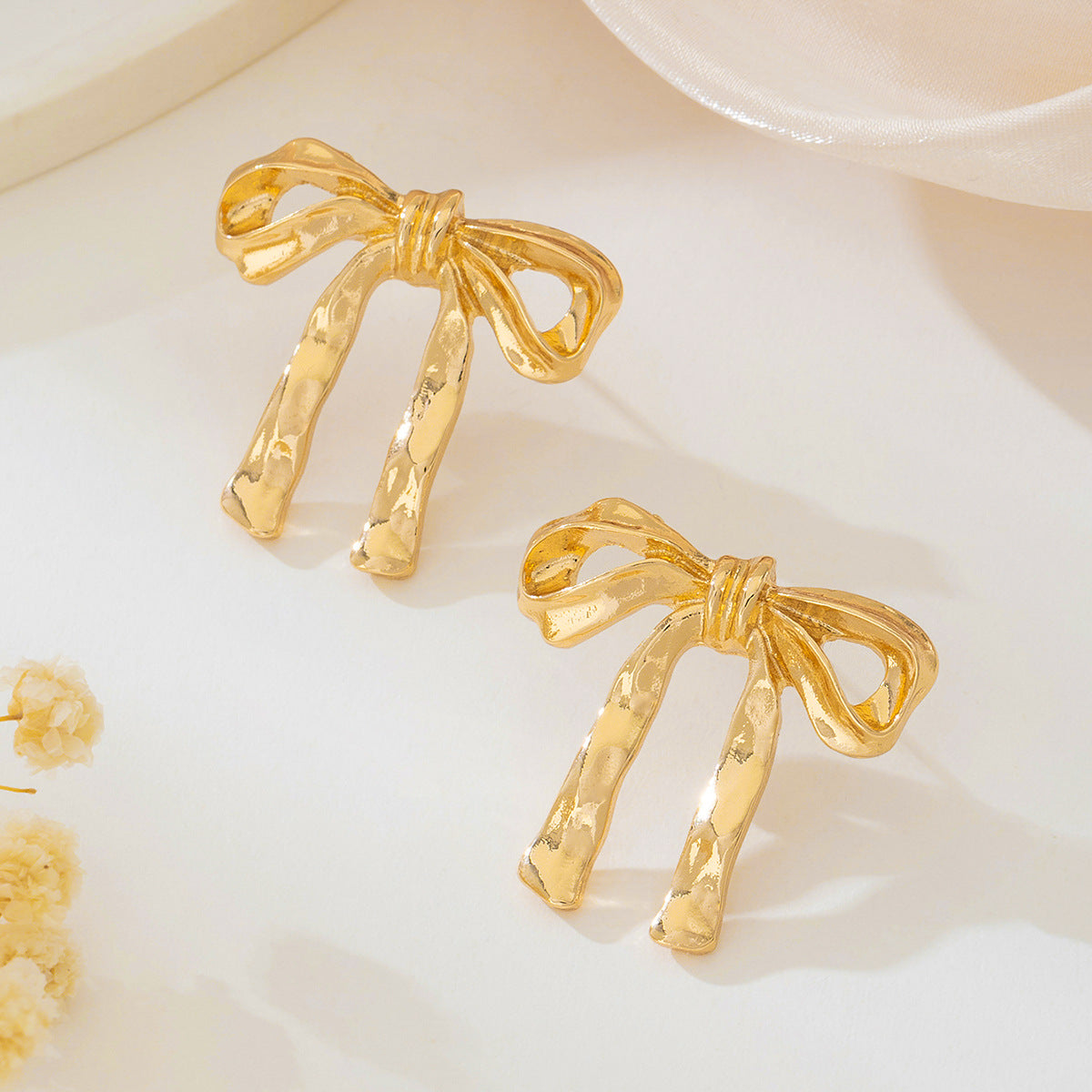 Planderful Vienna Verve Earrings – Exquisite Metal French Bow Design