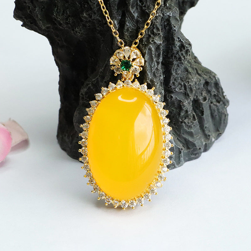 Golden Necklace with Chalcedony Pendant and Zircon Halo