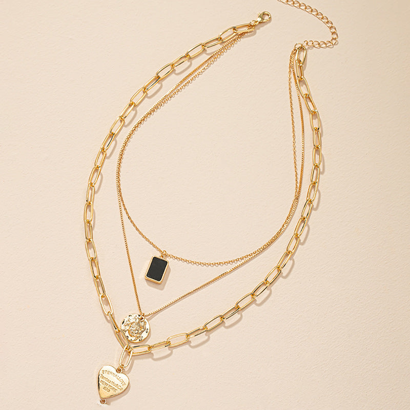 Golden Heart Pendant Collarbone Necklace with Luxe Layered Design