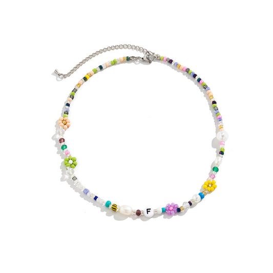Vibrant Hand-Woven Daisy and Pearl Necklace with Stylish Letter Accents