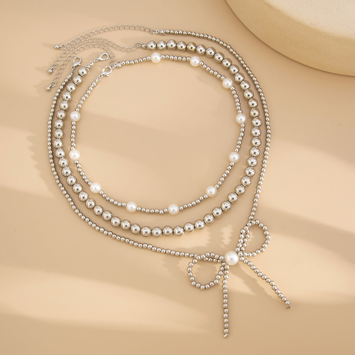 European and American fashion cross-border ins stacking imitation pearl necklace women, French temperament multi-layer bow beaded necklace decoration