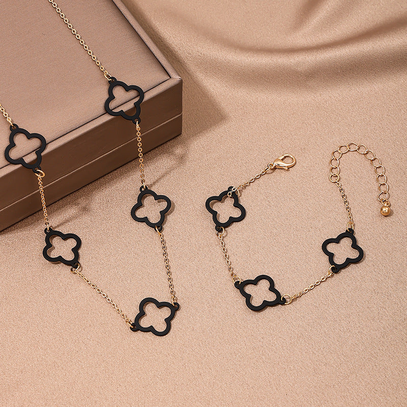 Stylish Modern Black Hollow Clover Metal Jewelry Set with Necklace and Bracelet