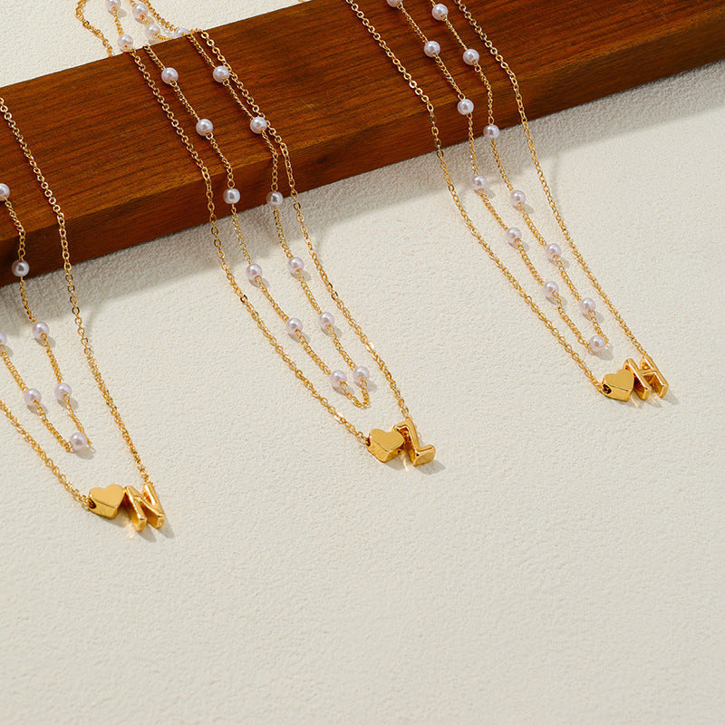 Elegant Pearl Collar Necklace with Metal Love Pendant