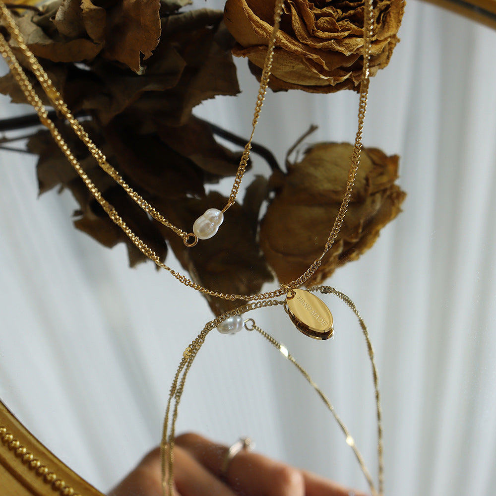 Elegant Multi-Layer Pearl Necklace with Gold Lock Bone Chain