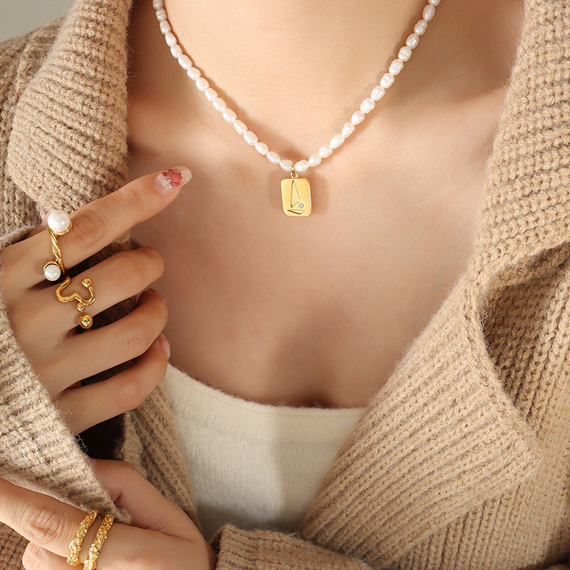 Luxury Irregular Pearl and Zircon Necklace with Titanium Steel Pendant