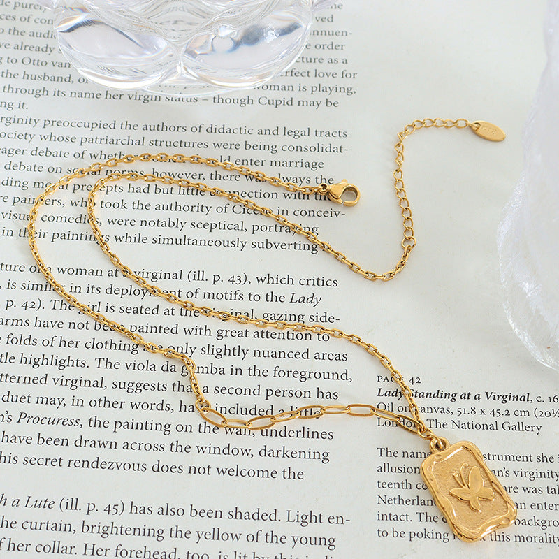 Butterfly Embossed Pendant Necklace with Gold Plated Chain and Clawbone Details