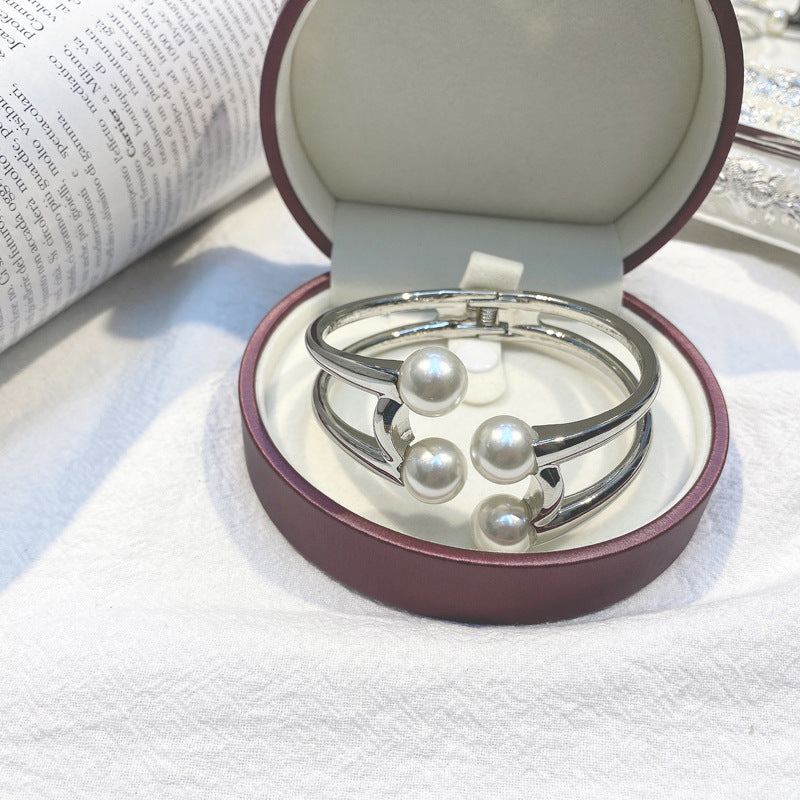 Mystique Pearl Bracelet - Exquisite Metal Bangle with Edgy Charm
