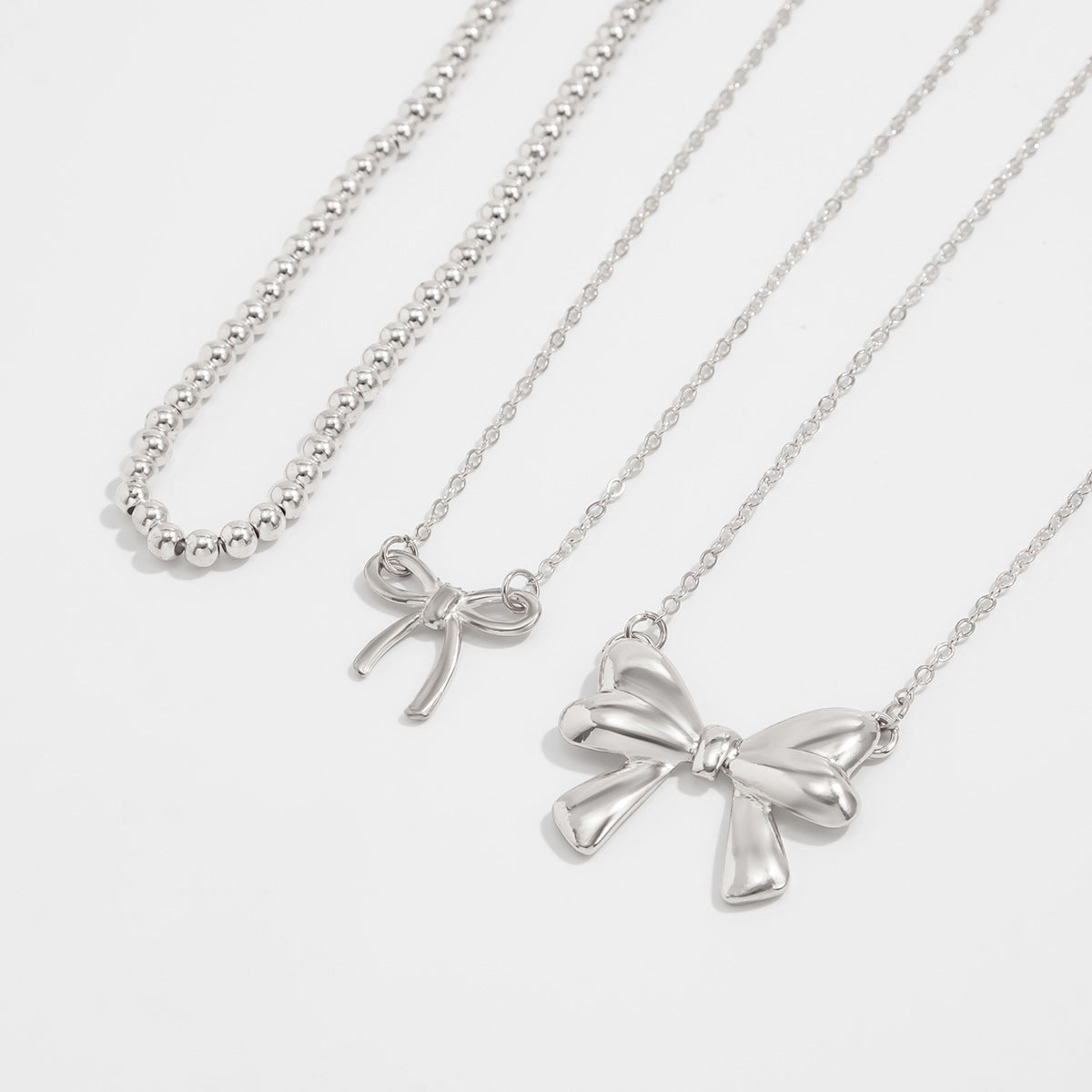 Layered Imitation Pearl Bow Tassel Necklace