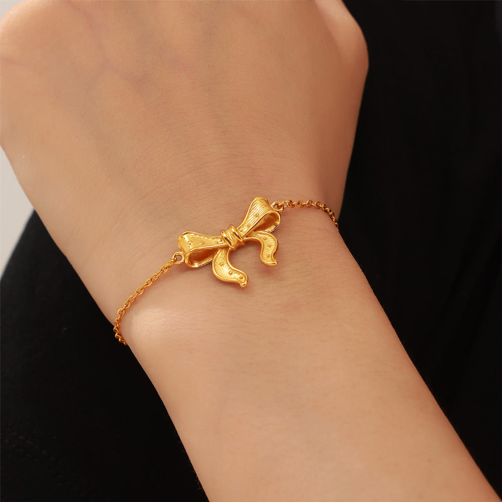 Elegant Bow Pendant Titanium Steel Gold-Plated Jewelry Set with Simple Design