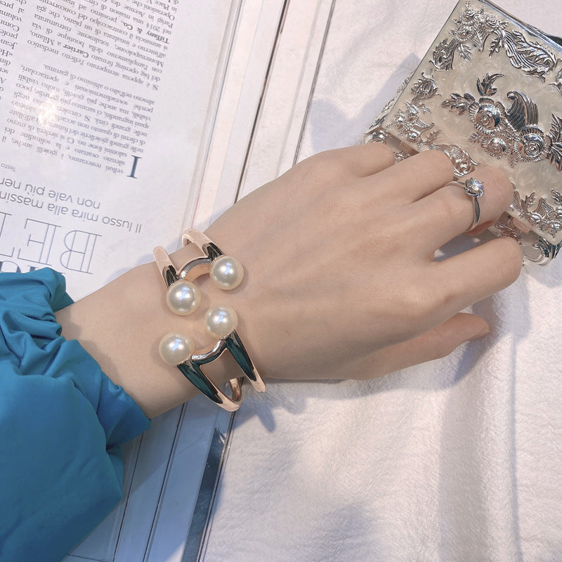 Mystique Pearl Bracelet - Exquisite Metal Bangle with Edgy Charm