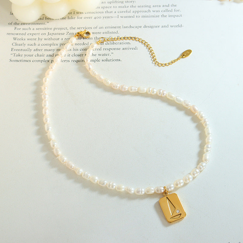 Luxury Irregular Pearl and Zircon Necklace with Titanium Steel Pendant