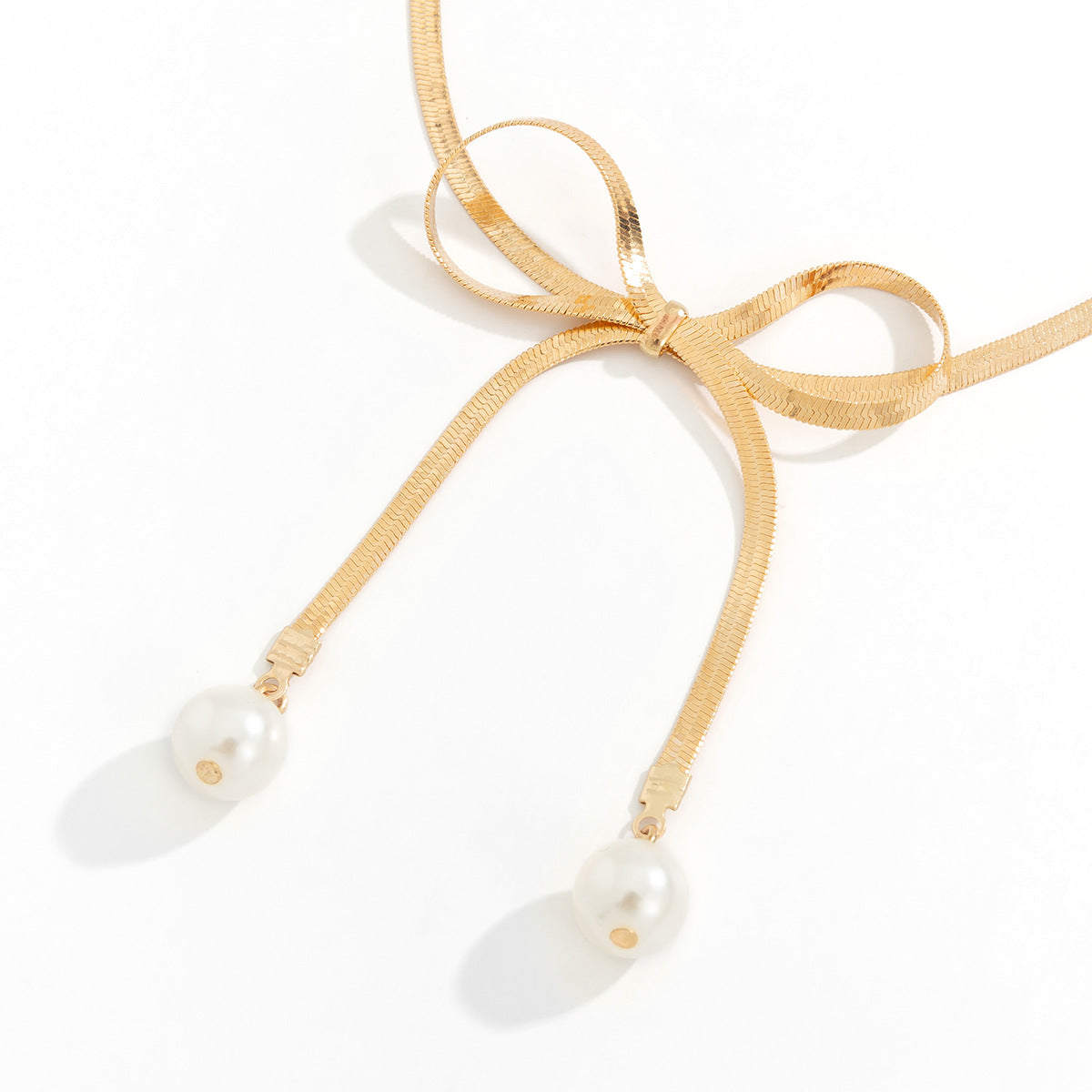 Versatile Tassel Necklace with Metal Bow and Pearl Beading