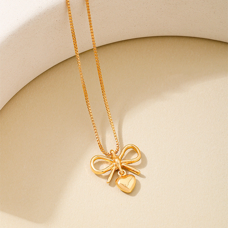 Planderful Vienna Verve Necklace – Elegant Metal Bow Design