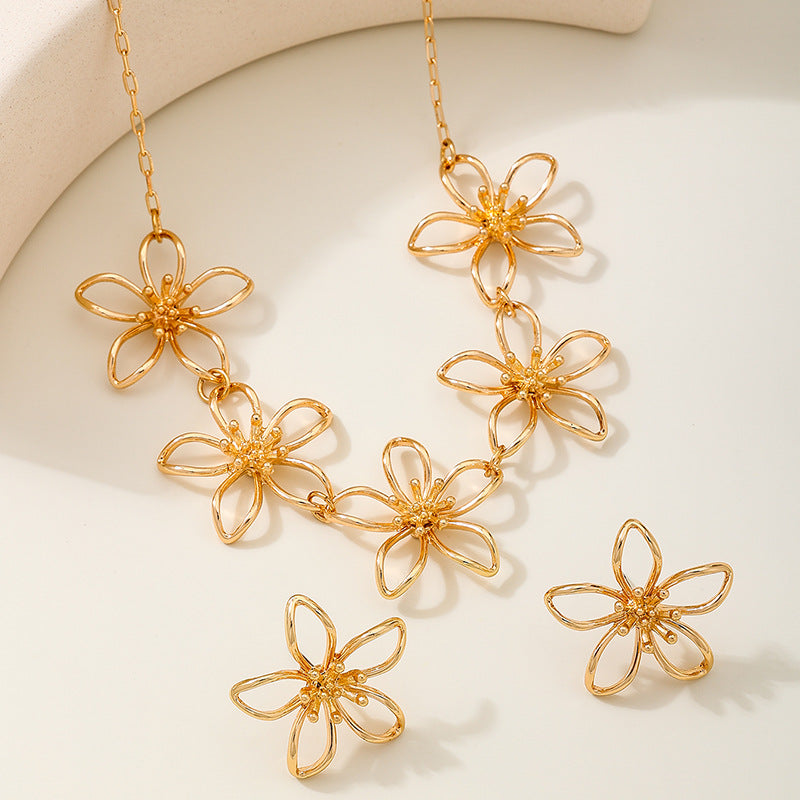 Elegant Women's Metal Lines Flower Jewelry Set by Planderful