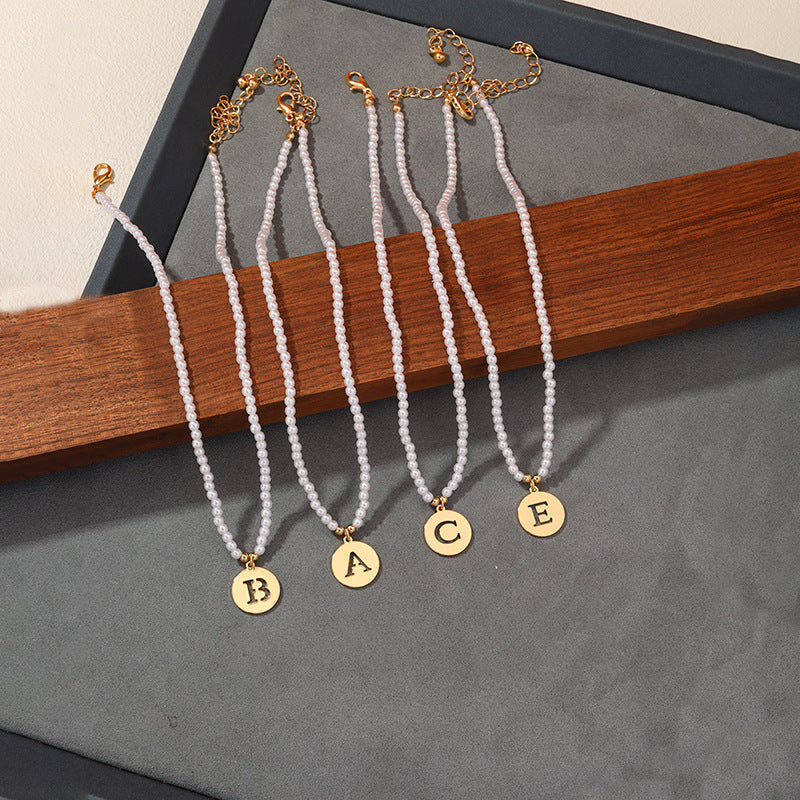Elegant Hollow English Letter Pendant Necklace with Pearl Accents