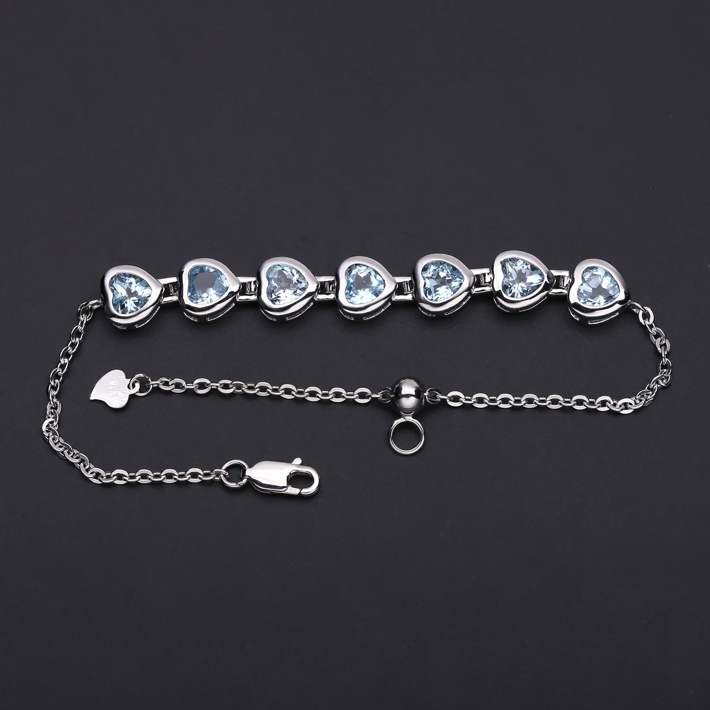 Row of Heart Shape Natural Blue Topaz Silver Bracelet