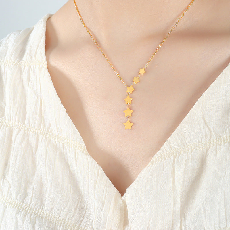 Whimsical Star Tassel Necklace with Fairy Charm