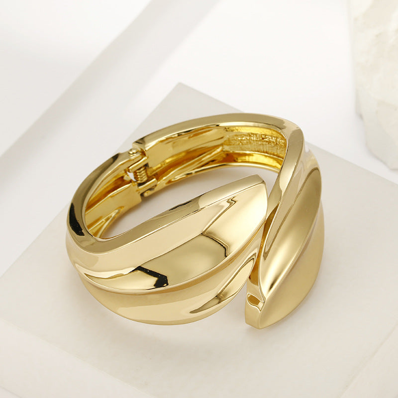 Glossy Gold Leaf Bracelet with Asymmetric Design
