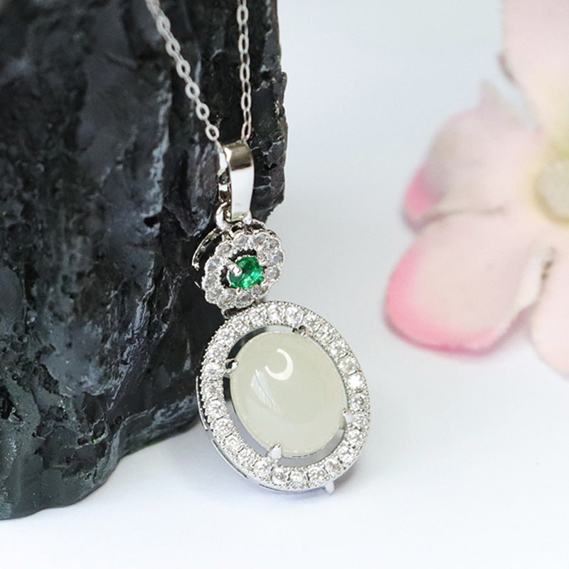 Oval White Jade Pendant with Zircon Halo in Sterling Silver