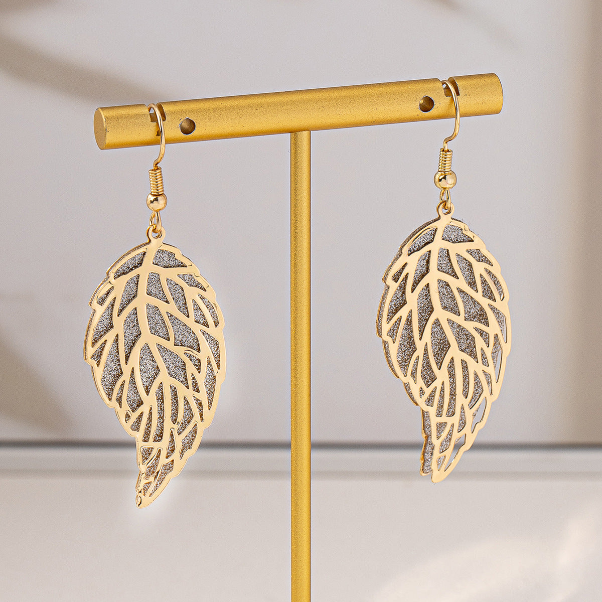 Planderful Vienna Verve Earrings – Stylish Metal Hollow Leaf Design