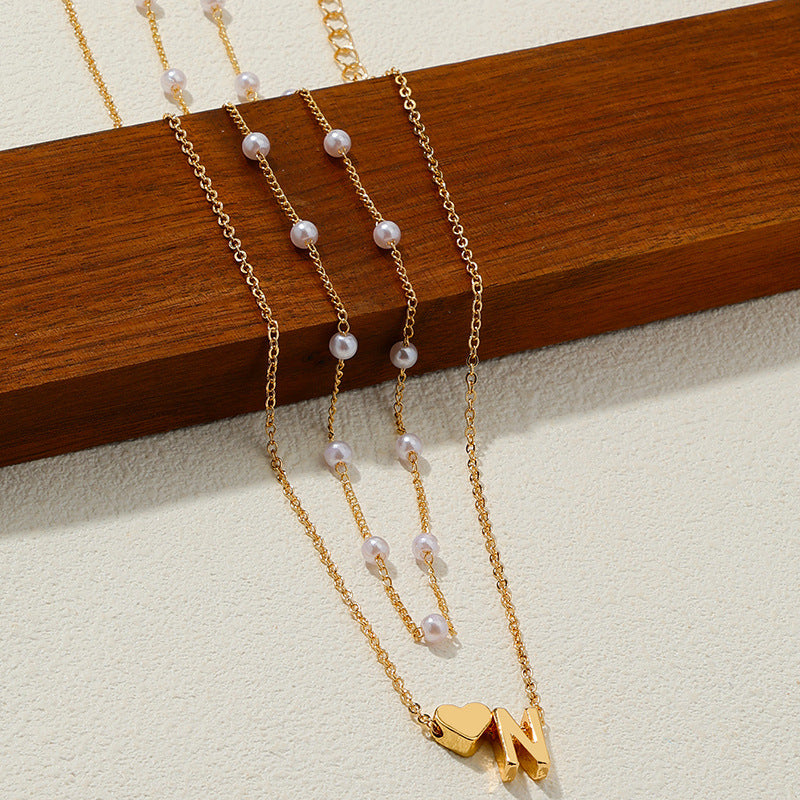 Elegant Pearl Collar Necklace with Metal Love Pendant