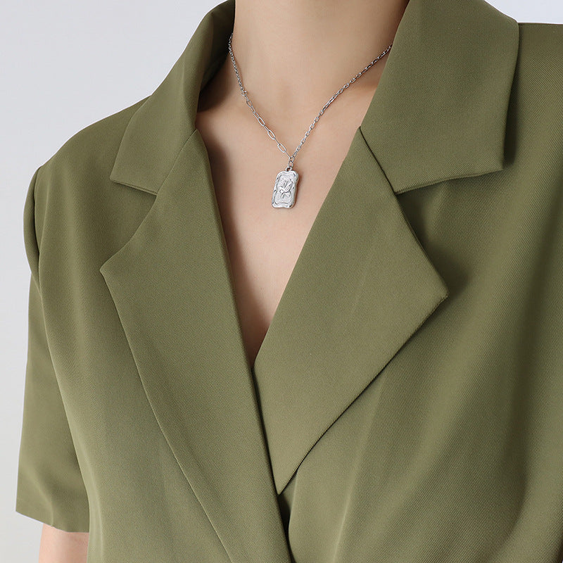 Butterfly Embossed Pendant Necklace with Gold Plated Chain and Clawbone Details