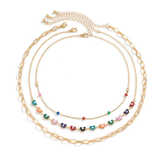 Colorful Oil Dropping Butterfly Eyes Necklace with Cross Pendant and Collar Chain for Women in Europe and America