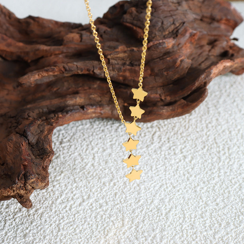 Whimsical Star Tassel Necklace with Fairy Charm