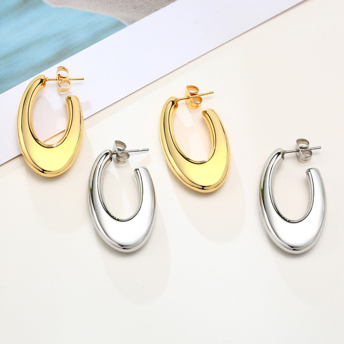 Gold-Tone Sculptural Oval Open Hoop Earrings